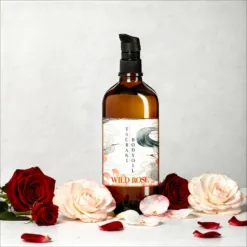 בקבוק זכוכית ענבר עם משאבה שחורה של שמן גוף WILD ROSE